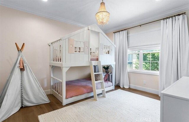 31 Harcourt, Newport Coast, CA 92657 - bedroom with baseboards, a chandelier, crown molding, wood finished floors, and recessed lighting