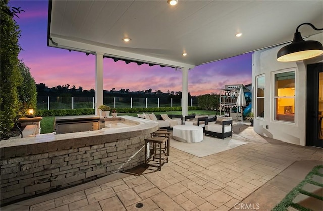 31 Harcourt, Newport Coast, CA 92657 - patio terrace at dusk with a patio area and outdoor lounge area