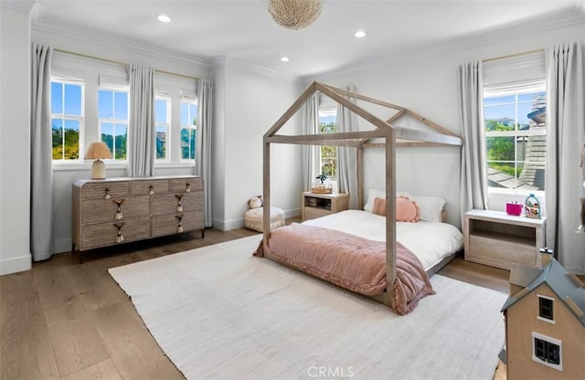31 Harcourt, Newport Coast, CA 92657 - bedroom with multiple windows, wood finished floors, baseboards, crown molding, and recessed lighting