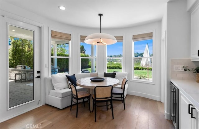 31 Harcourt, Newport Coast, CA 92657 - dining room featuring light wood finished floors, wine cooler, baseboards, recessed lighting, and breakfast area