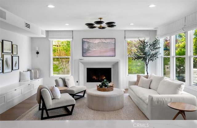 31 Harcourt, Newport Coast, CA 92657 - living room with a warm lit fireplace and recessed lighting