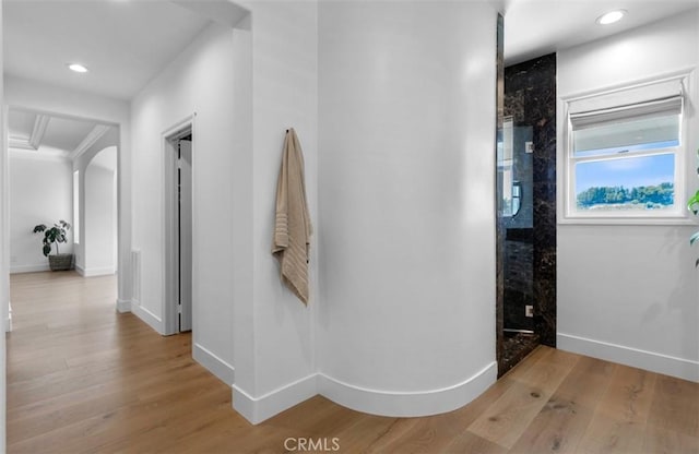 31 Harcourt, Newport Coast, CA 92657 - hallway featuring wood finished floors, recessed lighting, arched walkways, and baseboards