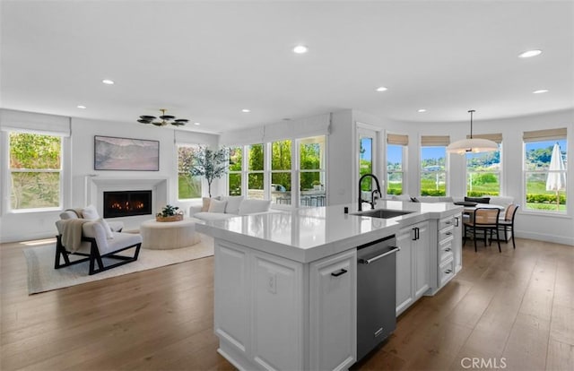31 Harcourt, Newport Coast, CA 92657 - kitchen with stainless steel dishwasher, a sink, white cabinets, recessed lighting, and light countertops