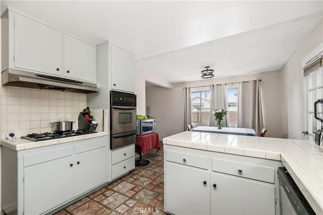 9861 E Lemon Ave, Arcadia, CA 91007 - kitchen with stainless steel appliances, a warming drawer, backsplash, and tile countertops