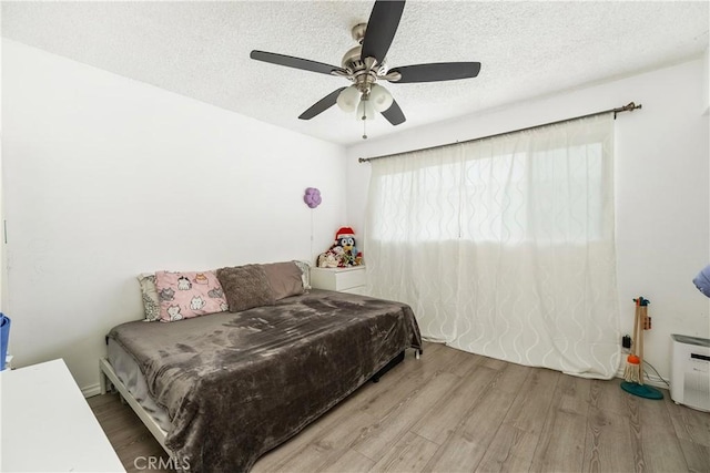 9861 E Lemon Ave, Arcadia, CA 91007 - bedroom featuring wood finished floors, a textured ceiling, and ceiling fan