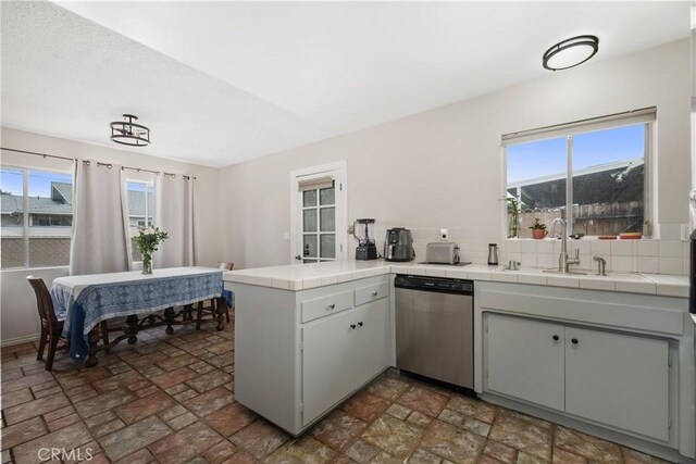 9861 E Lemon Ave, Arcadia, CA 91007 - kitchen featuring stainless steel dishwasher, a sink, tile countertops, a peninsula, and healthy amount of natural light