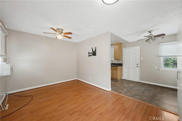 9861 E Lemon Ave, Arcadia, CA 91007 - unfurnished room with a ceiling fan, a textured ceiling, baseboards, and wood finished floors