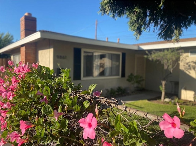 9861 E Lemon Ave, Arcadia, CA 91007 - view of front of home with a chimney