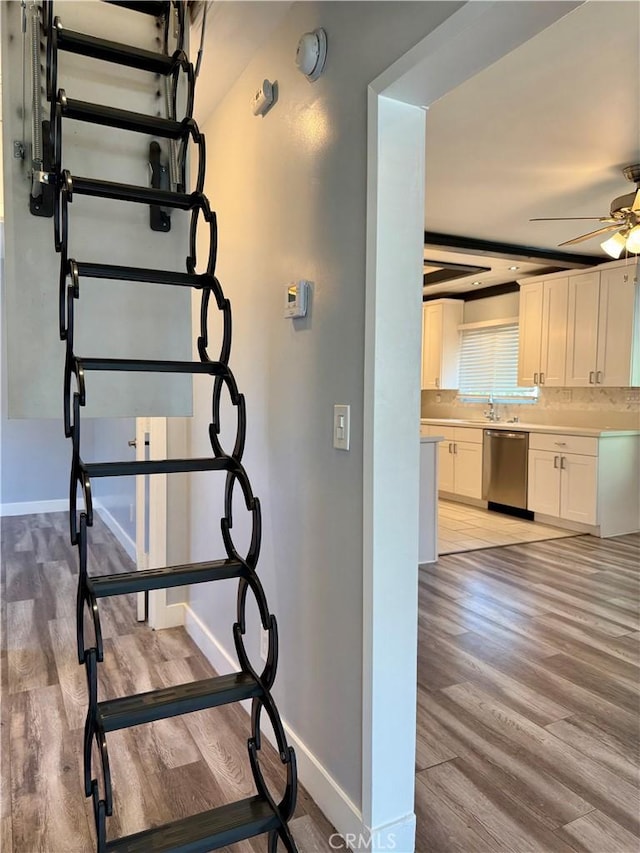5472 3rd Ave, Los Angeles, CA 90043 - stairs with wood finished floors, baseboards, and a ceiling fan