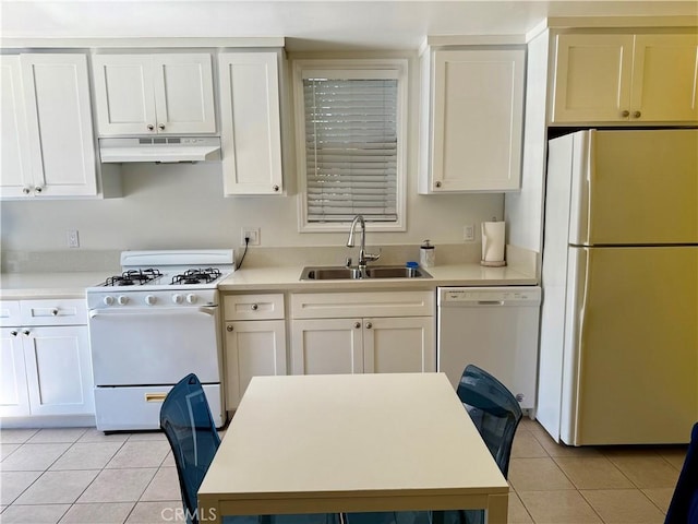 5472 3rd Ave, Los Angeles, CA 90043 - kitchen with white appliances, under cabinet range hood, a sink, light tile patterned flooring, and light countertops