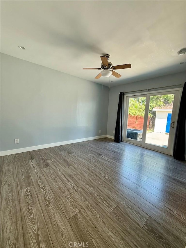 5472 3rd Ave, Los Angeles, CA 90043 - empty room with dark wood-type flooring, ceiling fan, and baseboards