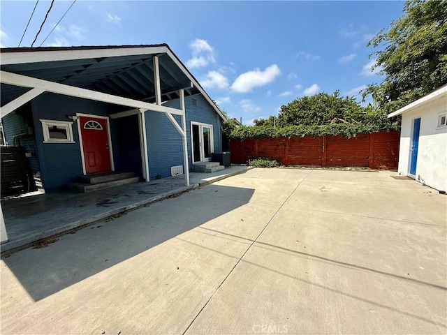 5472 3rd Ave, Los Angeles, CA 90043 - view of side of home featuring entry steps and a patio area