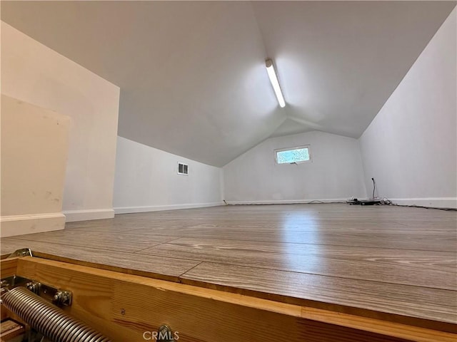 5472 3rd Ave, Los Angeles, CA 90043 - additional living space featuring vaulted ceiling, wood finished floors, and baseboards