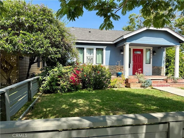 5472 3rd Ave, Los Angeles, CA 90043 - view of front of home with stone siding, a porch, and a shingled roof