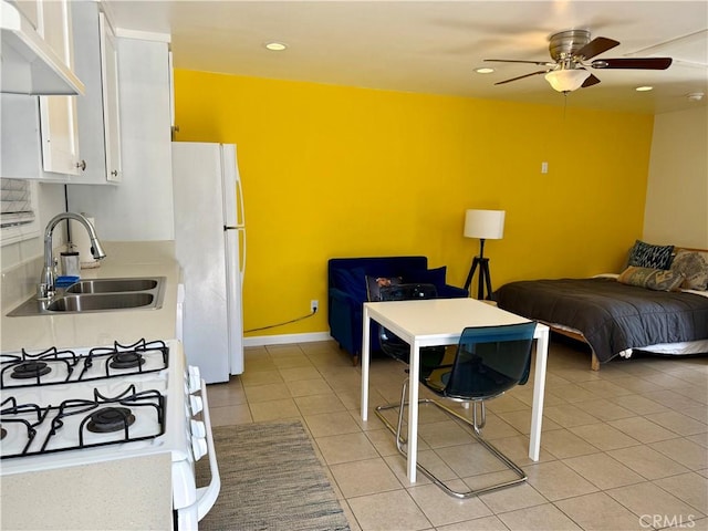5472 3rd Ave, Los Angeles, CA 90043 - bedroom featuring a sink, freestanding refrigerator, light tile patterned flooring, recessed lighting, and ceiling fan