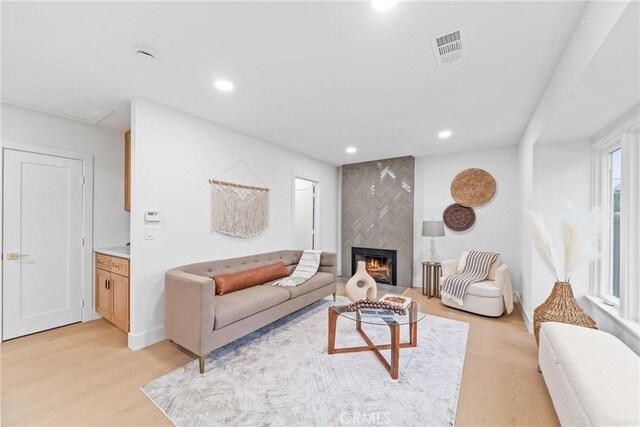 34021 La Serena Dr, Dana Point, CA 92629 - living area featuring light wood finished floors, a tiled fireplace, and recessed lighting