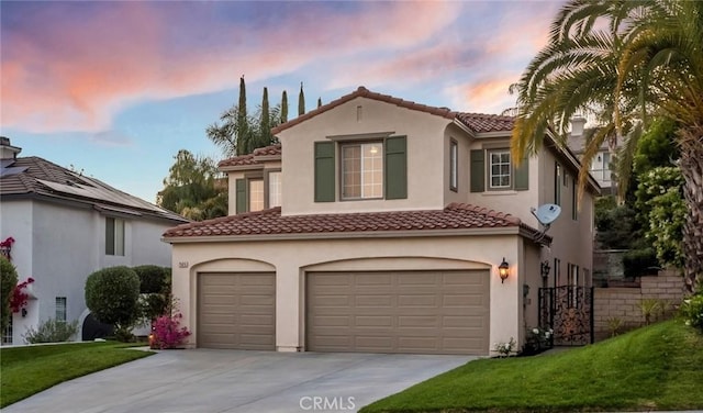 25815 Forsythe Way, Stevenson Ranch, CA 91381 - mediterranean / spanish house featuring an attached garage, driveway, stucco siding, a tiled roof, and a yard