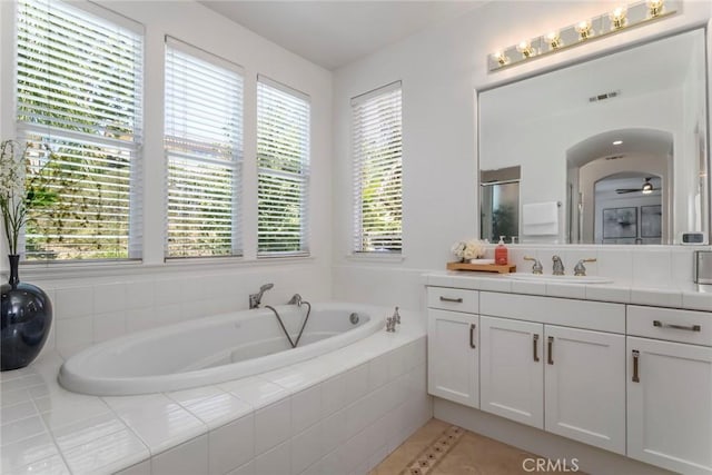25815 Forsythe Way, Stevenson Ranch, CA 91381 - bathroom with vanity, a garden tub, healthy amount of natural light, and tile patterned flooring