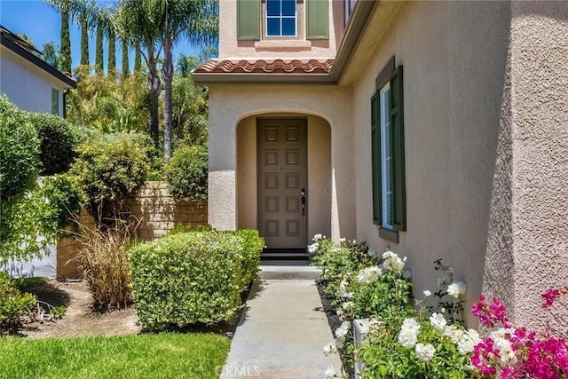 25815 Forsythe Way, Stevenson Ranch, CA 91381 - view of exterior entry featuring stucco siding and a tile roof