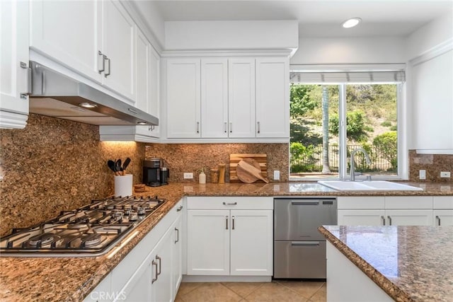 25815 Forsythe Way, Stevenson Ranch, CA 91381 - kitchen featuring a sink, under cabinet range hood, appliances with stainless steel finishes, white cabinetry, and light tile patterned floors