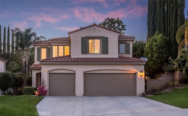 25815 Forsythe Way, Stevenson Ranch, CA 91381 - mediterranean / spanish-style house featuring a garage, a tiled roof, driveway, stucco siding, and a front lawn