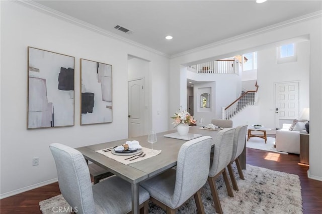 25815 Forsythe Way, Stevenson Ranch, CA 91381 - dining room with stairs, dark wood-style floors, ornamental molding, recessed lighting, and baseboards