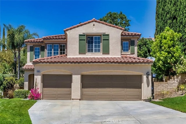 25815 Forsythe Way, Stevenson Ranch, CA 91381 - mediterranean / spanish-style house featuring driveway, an attached garage, stucco siding, and a tile roof