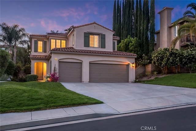 25815 Forsythe Way, Stevenson Ranch, CA 91381 - mediterranean / spanish house with a tile roof, a garage, driveway, stucco siding, and a front lawn