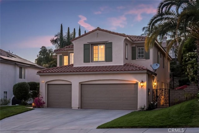 25815 Forsythe Way, Stevenson Ranch, CA 91381 - mediterranean / spanish house with a garage, concrete driveway, a tile roof, stucco siding, and a front yard
