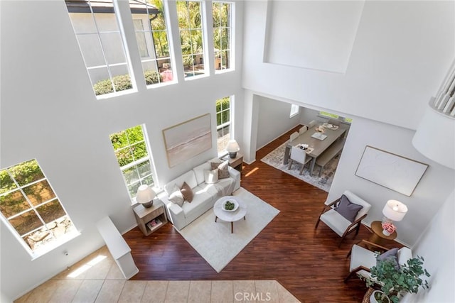 25815 Forsythe Way, Stevenson Ranch, CA 91381 - living area featuring a high ceiling and wood finished floors