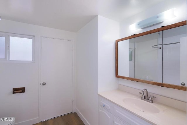 5020 Carolyn Way, Glendale, CA 91214 - bathroom with vanity, wood finished floors, and baseboards