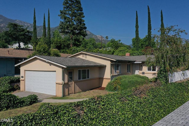 5020 Carolyn Way, Glendale, CA 91214 - ranch-style house featuring a garage, stucco siding, a mountain view, and a chimney