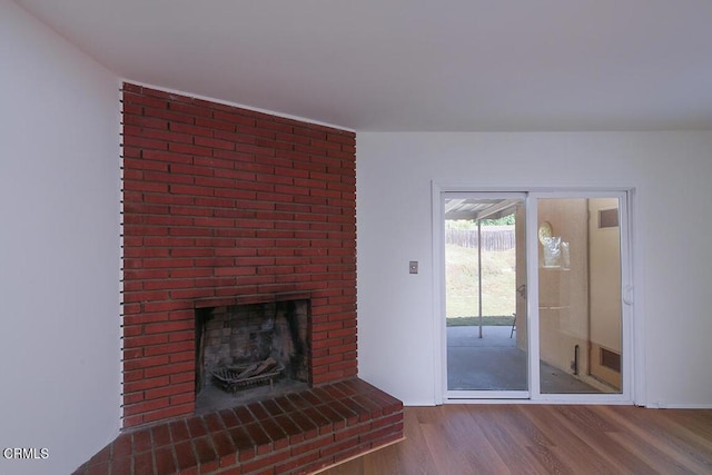 5020 Carolyn Way, Glendale, CA 91214 - unfurnished living room with wood finished floors, a fireplace, and baseboards