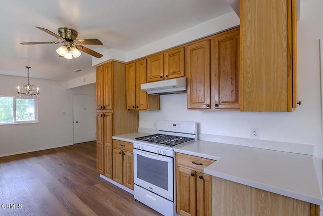 5020 Carolyn Way, Glendale, CA 91214 - kitchen featuring gas range gas stove, under cabinet range hood, light countertops, ceiling fan, and dark wood-style flooring