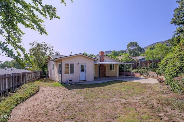 5020 Carolyn Way, Glendale, CA 91214 - back of house with a patio area, stucco siding, a chimney, and a mountain view