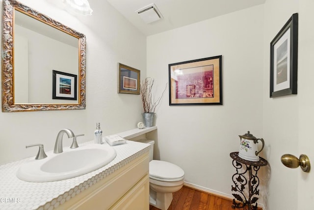 18751 Hatteras St Unit 13, Tarzana, CA 91356 - bathroom featuring vanity, toilet, wood finished floors, and baseboards