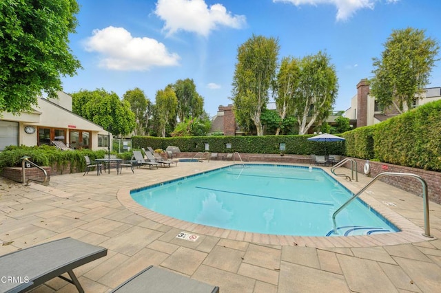 18751 Hatteras St Unit 13, Tarzana, CA 91356 - community pool featuring a patio