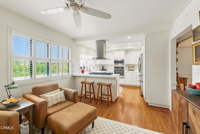 18751 Hatteras St Unit 13, Tarzana, CA 91356 - living room featuring light wood-style floors and ceiling fan
