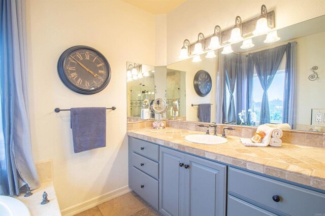 11606 Mesa Verde Dr, Valley Center, CA 92082 - bathroom featuring vanity, baseboards, tile patterned flooring, and a tub