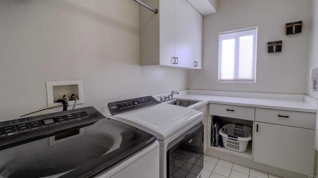11606 Mesa Verde Dr, Valley Center, CA 92082 - washroom with washer and dryer, cabinet space, and light tile patterned floors