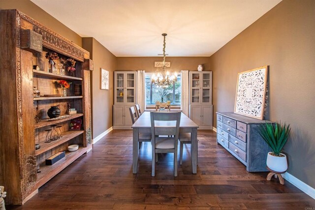11606 Mesa Verde Dr, Valley Center, CA 92082 - dining space featuring a chandelier, dark wood-type flooring, and baseboards