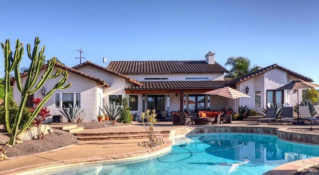 11606 Mesa Verde Dr, Valley Center, CA 92082 - back of house with an outdoor living space, a tile roof, a patio area, and a chimney