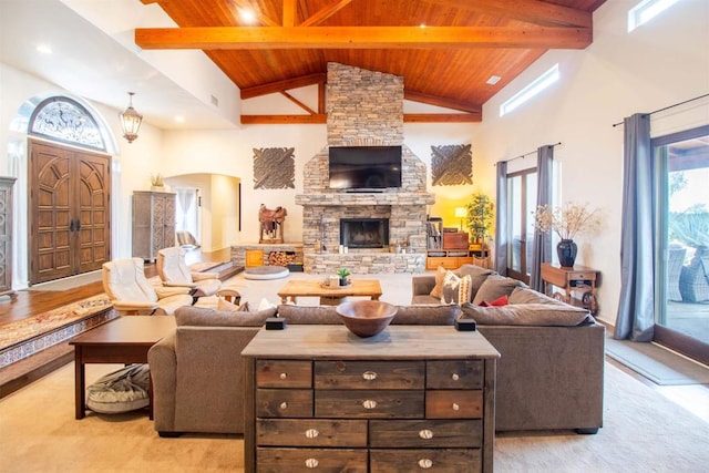 11606 Mesa Verde Dr, Valley Center, CA 92082 - living area featuring wooden ceiling with exposed beams, high vaulted ceiling, arched walkways, a fireplace, and baseboards