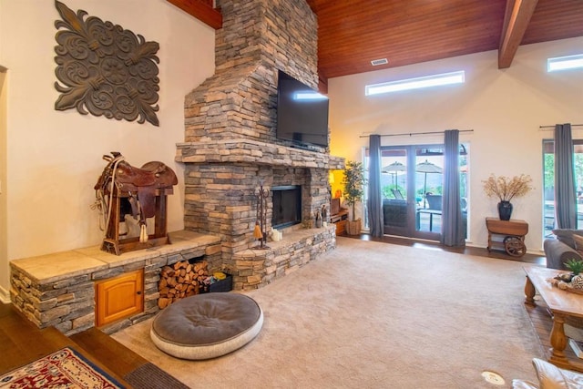 11606 Mesa Verde Dr, Valley Center, CA 92082 - living area with a stone fireplace, wooden ceiling with exposed beams, a high ceiling, and baseboards