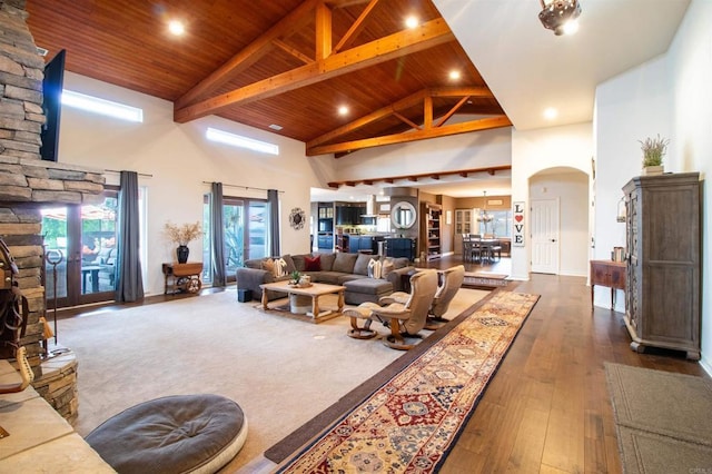 11606 Mesa Verde Dr, Valley Center, CA 92082 - living area featuring high vaulted ceiling, wooden ceiling with exposed beams, arched walkways, dark wood finished floors, and recessed lighting