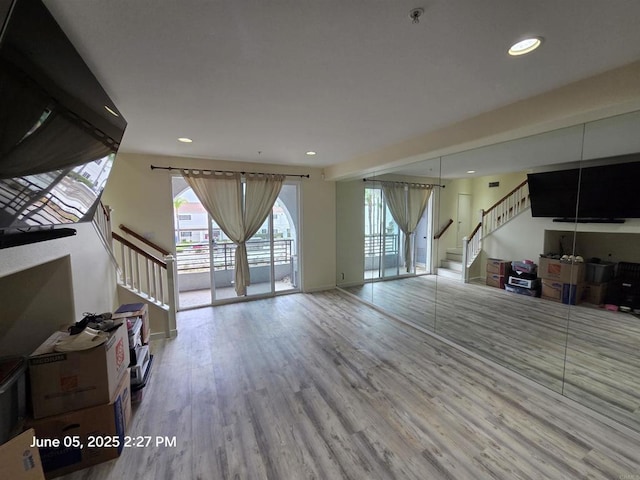 1760 E Palomar St Unit 111, Chula Vista, CA 91913 - living area with stairway, wood finished floors, and recessed lighting