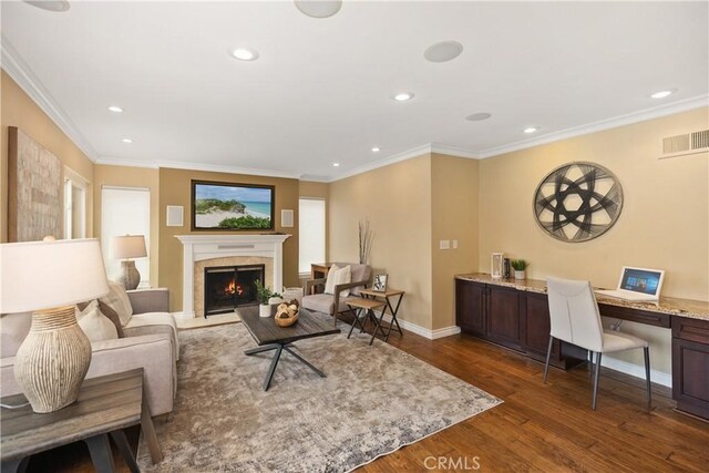 29162 Bobolink Dr, Laguna Niguel, CA 92677 - living room with dark wood-type flooring, an office area, a warm lit fireplace, recessed lighting, and baseboards