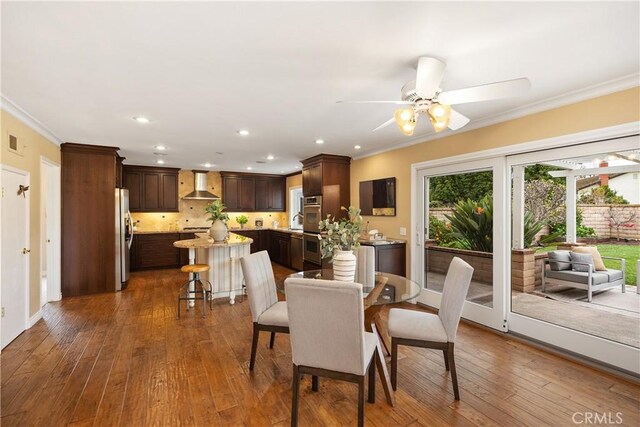 29162 Bobolink Dr, Laguna Niguel, CA 92677 - dining area with crown molding, ceiling fan, dark wood-type flooring, and recessed lighting