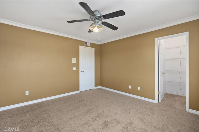 29162 Bobolink Dr, Laguna Niguel, CA 92677 - unfurnished bedroom featuring crown molding, baseboards, carpet, a spacious closet, and a ceiling fan