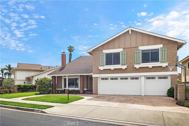 29162 Bobolink Dr, Laguna Niguel, CA 92677 - traditional-style house with concrete driveway, a garage, a front yard, and board and batten siding